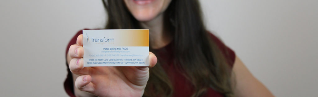 Skye holds Transform business card
