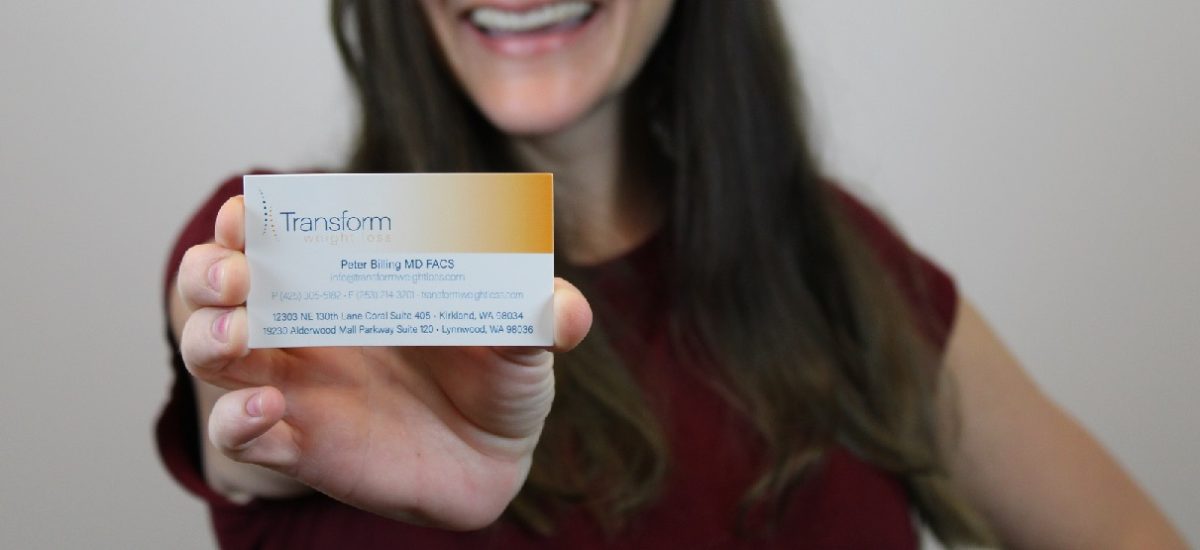 Skye holds Transform business card